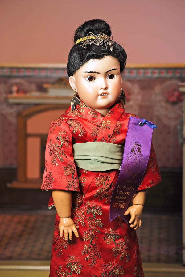 GERMAN BISQUE ORIENTAL DOLL BY BRUNO SCHMIDT. Mar: GERMAN BISQUE ORIENTAL DOLL BY BRUNO SCHMIDT. Marks: 500 BSW.in heart. 18". Olive-toned bisque socket head, brown sleep eyes, painted lashes, black feathered brows, open mouth, accented lips, upper te