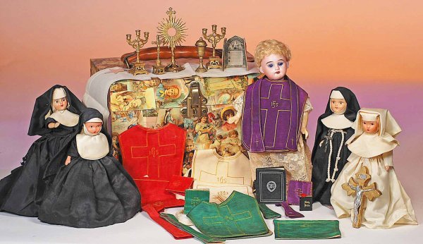 GERMAN BISQUE DOLL AS PRIEST - PRESENTED WITH SMAL: GERMAN BISQUE DOLL AS PRIEST - PRESENTED WITH SMALL NUNS & ACCESSORIES. Marks: Bisque doll A.M. 1894. 10 ½". Bisque socket head with inset blue glass eyes, open mouth, original wig, composition joint
