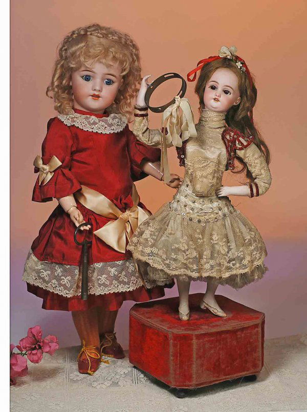 FRENCH BISQUE AUTOMATON "TAMBOURINE DANCER" BY ROU: FRENCH BISQUE AUTOMATON "TAMBOURINE DANCER" BY ROULETT & DECAMPS. Marks: S & H 1078 (head). 21". Bisque head doll stands upon a velvet-covered wooden base with clockwork mechanism; has brown stationar