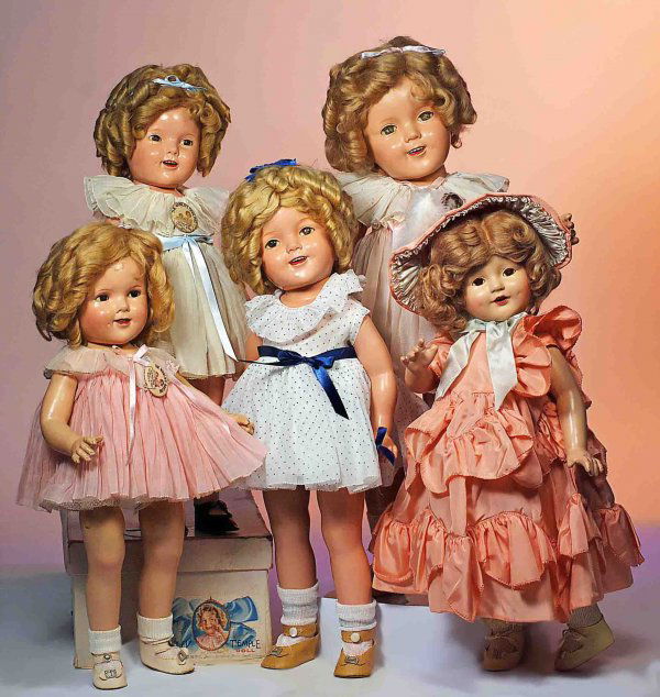 SHIRLEY TEMPLE COMPOSITION DOLL IN PINK "BABY TAKE: SHIRLEY TEMPLE COMPOSITION DOLL IN PINK "BABY TAKE A BOW" DRESS. Marks: 25 Shirley Temple Ideal N & T. 25". Composition socket head, five-piece jointed body, sleep eyes, open mouth, dimples, blonde mo