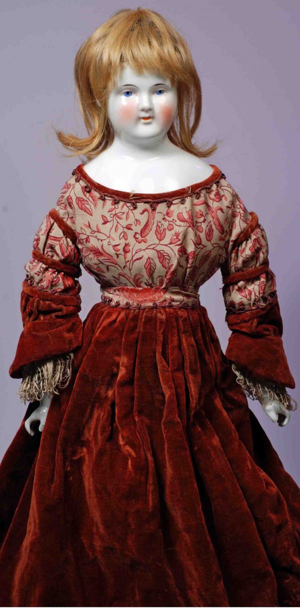 LARGE BEIDERMEIER CHINA LADY.: 26”. China shoulderhead, solid-dome with painted black pate, blonde human hair wig, painted features, blue eyes, pink and black lid lines, tapered brows, closed mouth with slightly upturned corners