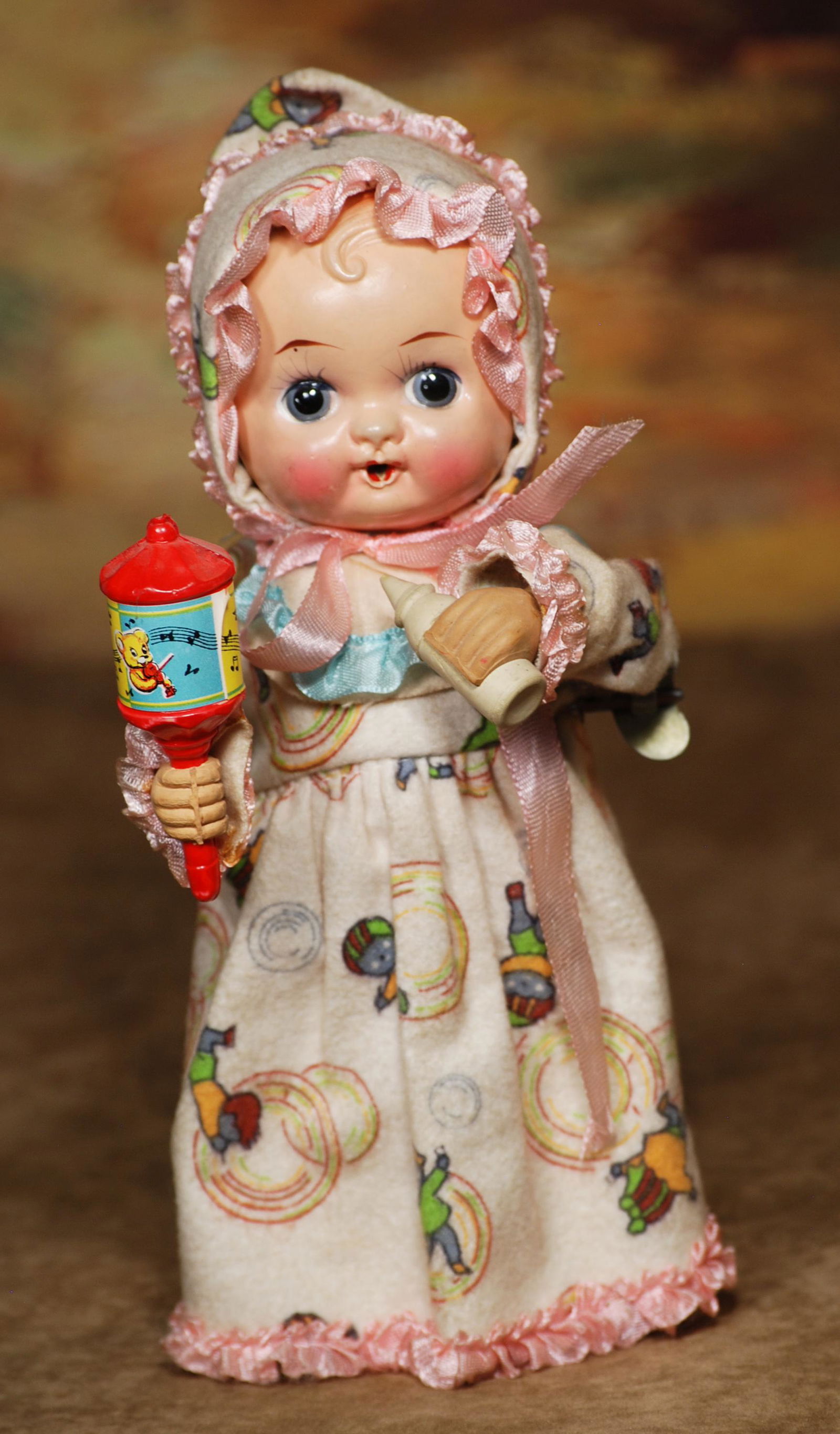 KEY-WIND CELLULOID DOLL WITH MUSICAL RATTLE AND NURSING (1 of 1)