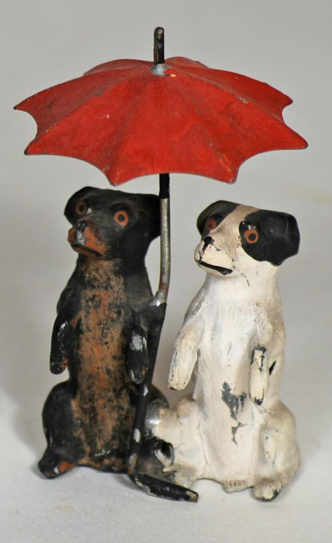 MINIATURE PAIR OF LEAD DOGS UNDER RED UMBRELLA (1 of 1)
