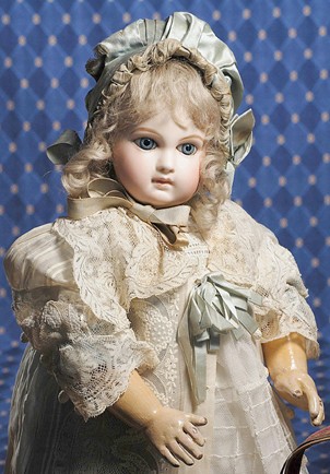JUMEAU PORTRAIT BEBE OF SUPERB QUALITY WITH "AU PA: JUMEAU PORTRAIT BEBE OF SUPERB QUALITY WITH "AU PAPA ENTRENNES" SHOP LABEL. Marks: 7 (head); "Au Papa Entrennes/Boulevard Poissonniere 23 Paris/Speciality de Poupees/Physique Amusante" (label on torso