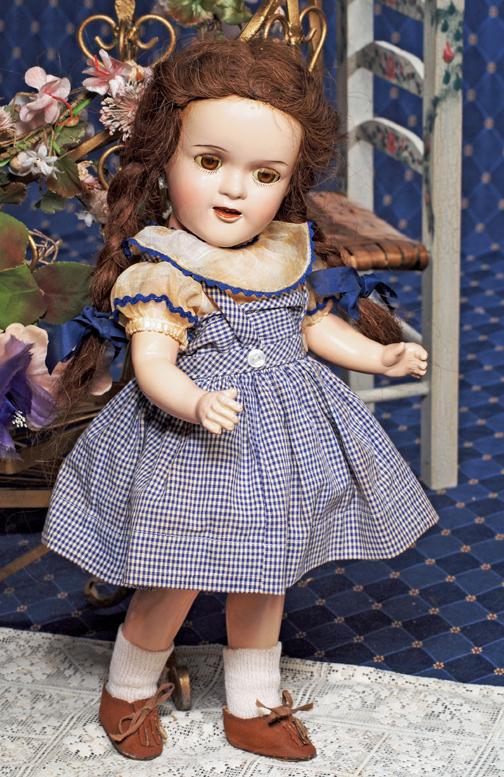 ALL-ORIGINAL "JUDY GARLAND" AS DOROTHY IN THE "WI: ALL-ORIGINAL "JUDY GARLAND" AS DOROTHY IN THE "WIZARD OF OZ" COMPOSITION DOLL BY IDEAL. Marks: Ideal Doll (head); USA 16 (body). 16". Composition socket head on five-piece jointed composition body, br