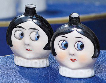 PAIR OF GOOGLY-EYED GLASS PERFUME BOTTLES BY HERTW: PAIR OF GOOGLY-EYED GLASS PERFUME BOTTLES BY HERTWIG. Marks: Germany. 1 ¾". Each has sculpted face with flat back, large round and side-glancing blue eyes, painted black hair, white neck ruff. Commen