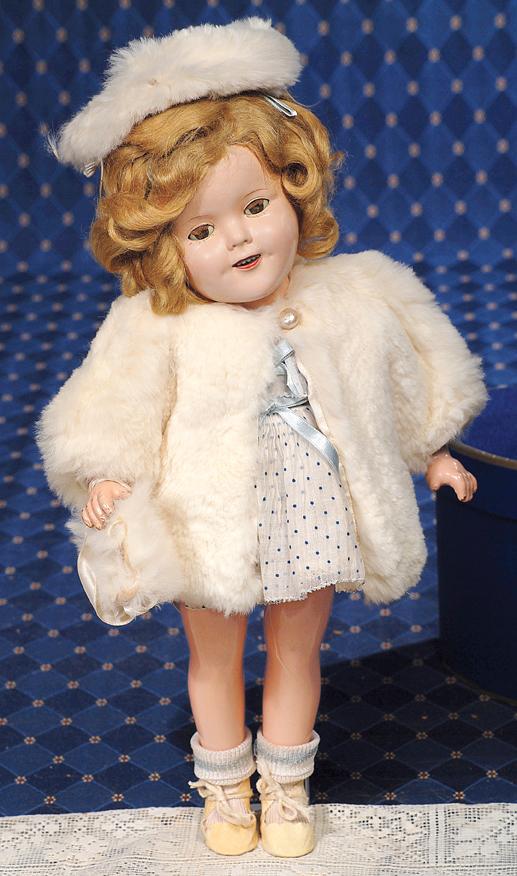 SHIRLEY TEMPLE COMPOSITION DOLL IN "CURLY TOP DRE: SHIRLEY TEMPLE COMPOSITION DOLL IN "CURLY TOP DRESS, FUR COAT, HAT & MUFF". Marks: 50 Shirley Temple (head); USA 12(body). 15". Composition socket head on five-piece jointed body, sleep eyes, applied 