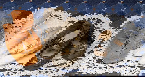 THREE PAIR OF ANTIQUE DOLL BOOTS & SHOES. Includ: THREE PAIR OF ANTIQUE DOLL BOOTS & SHOES. Includes: (1) 2 ¾" L. pair of brown suede leather boots with lace-up front, leather soles; 2 ¾" pair of white leather boots with four-button side closing, l