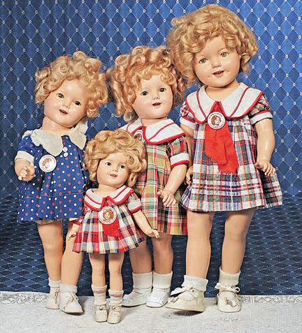 IDEAL SHIRLEY TEMPLE COMPOSITION DOLL IN NAVY BLU: IDEAL SHIRLEY TEMPLE COMPOSITION DOLL IN NAVY BLUE POLKA DOT DRESS . Marks: Shirley Temple Copr. Ideal N & T (head); Shirley Temple (body). 18" Composition socket head on five-piece jointed body, slee