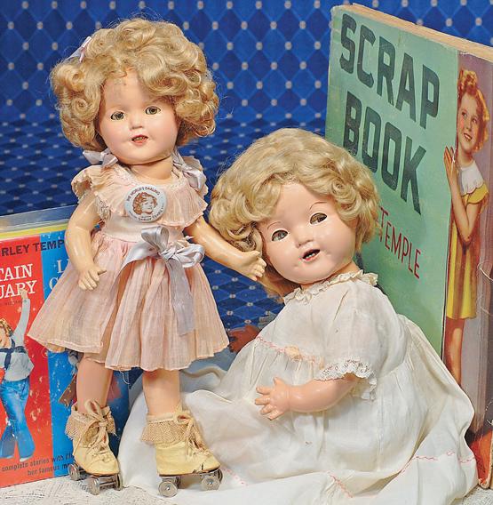 IDEAL SHIRLEY TEMPLE COMPOSITION DOLL IN PINK PLE: IDEAL SHIRLEY TEMPLE COMPOSITION DOLL IN PINK PLEATED DRESS. Marks: Shirley Temple (head); 13 Shirley Temple (body). 13". Composition socket head on five-piece jointed body, sleep eyes, applied and pa