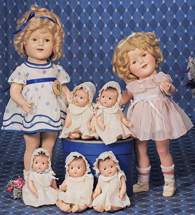 IDEAL SHIRLEY TEMPLE COMPOSITION DOLL IN "CURLY T: IDEAL SHIRLEY TEMPLE COMPOSITION DOLL IN "CURLY TOP" DRESS. Marks: Shirley Temple 50 (on head); Shirley Temple (on body). 16". Composition socket head on five-piece jointed body, sleep eyes, applied a