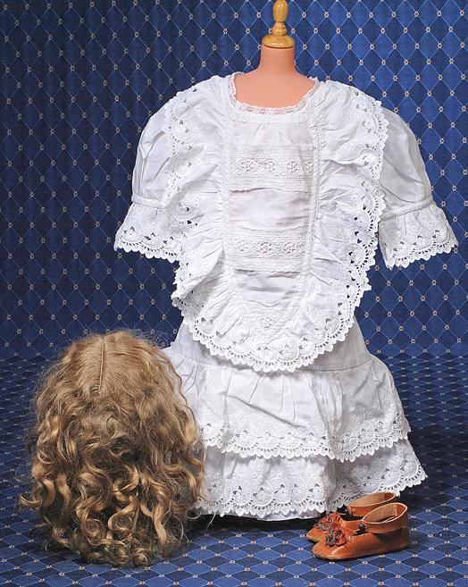 WHITE COTTON DOLL DRESS, VINTAGE MOHAIR WIG & LEA: WHITE COTTON DOLL DRESS, VINTAGE MOHAIR WIG & LEATHER DOLL SHOES. Dress is made of white cotton which has lavishly detailed eyelet bodice with cut-work detail, gathered sleeves with eyelet trim and sk