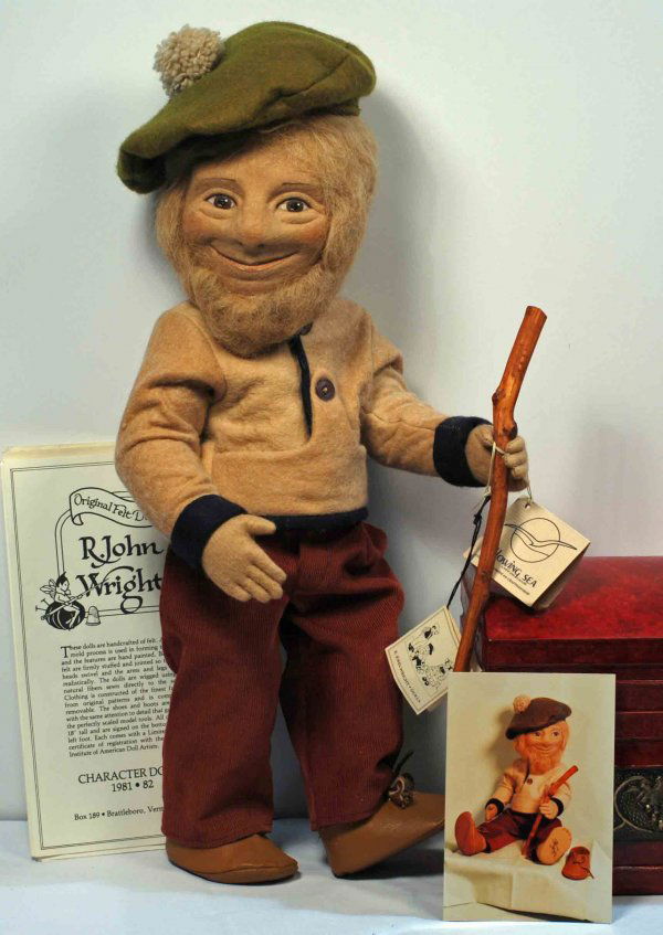 R. JOHN WRIGHT "MACTAVISH" CIRCA 1979-1981: AMERICAN CLOTH ARTIST DOLL "MACTAVISH" BY R. JOHN WRIGHT Marks: R.John Wright (foot) MacTavish (name on original attached booklet). 17". Pressed felt swivel head with highly characterized features of