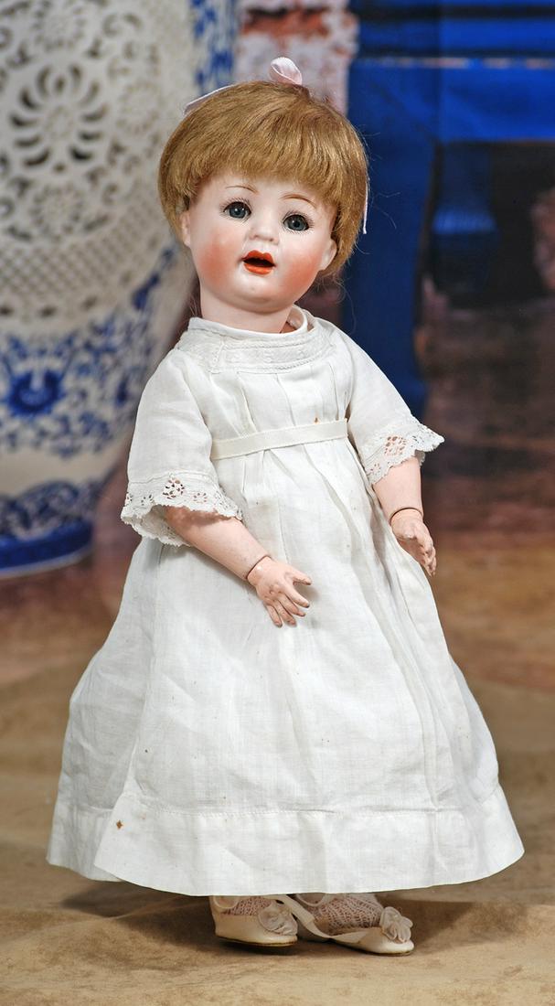 109. PETITE BISQUE CHARACTER BY GOEBEL. 12”.: 109. PETITE BISQUE CHARACTER BY GOEBEL. 12”. Marks: Bee symbol/G over W, B-5/0 Germany. Bisque socket head, blue sleep eyes, painted and applied lashes, feathered brows, open mouth, accented lip