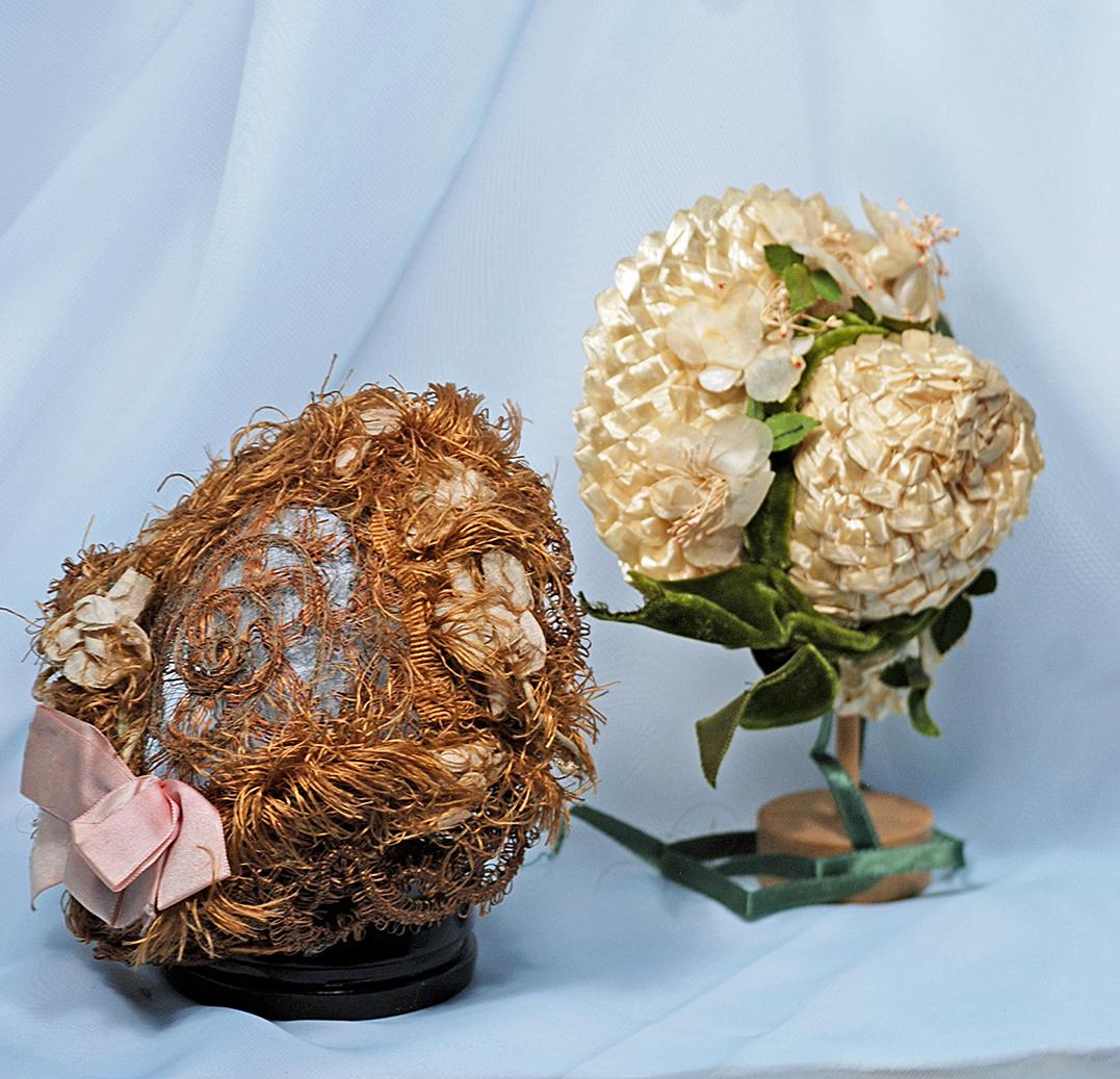 123.  TWO DOLL BONNETS.  Intricately woven antique (1 of 1)