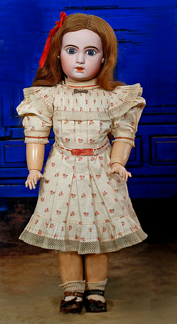 137. LARGE JUMEAU BISQUE BEBE IN ORIGINAL CHEMISE.: 137. LARGE JUMEAU BISQUE BEBE IN ORIGINAL CHEMISE. 28”. Marks: X 13 (head); Jumeau Bebe Diplome d’Honneur (body). Bisque socket head, large blue paperweight eyes, painted lashes, eyeliner,