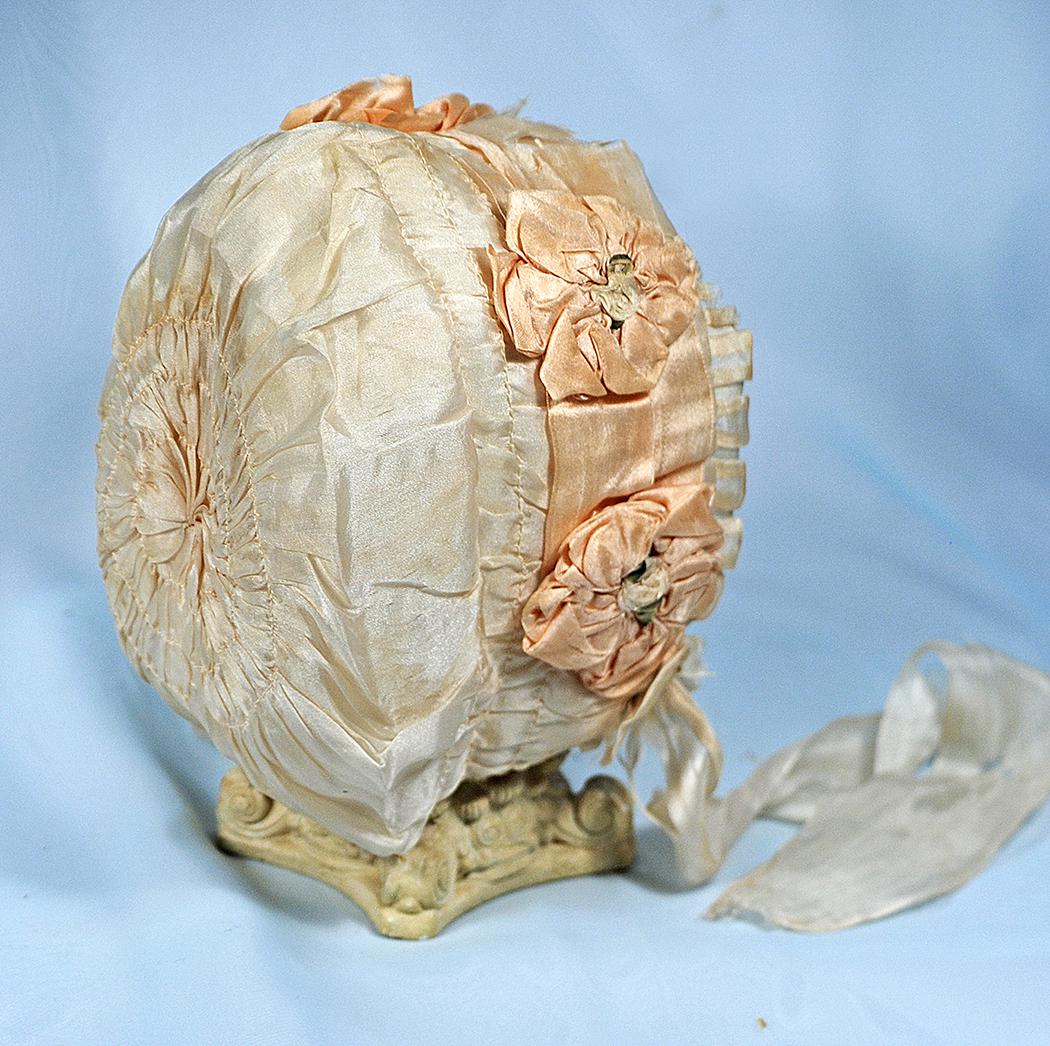 196.  ANTIQUE SILK DOLL BONNET.  Fine ivory silk padded (1 of 1)