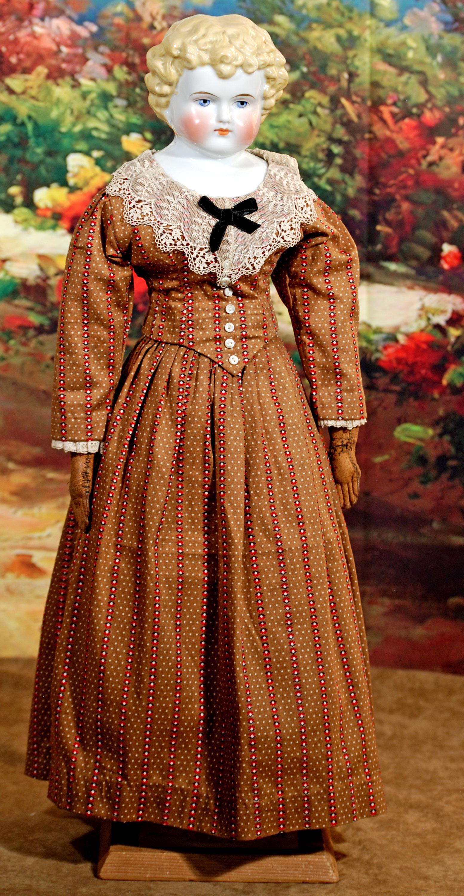 216. GERMAN BLONDE-HAIRED CHINA LADY.  23”. (1 of 2)