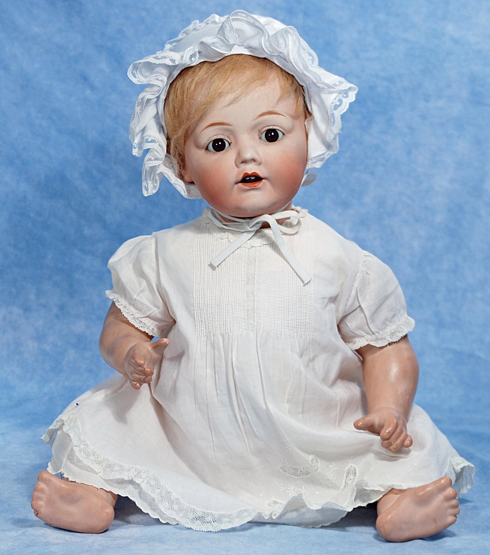 222. NIPPON BISQUE CHARACTER BABY. 21”. Marks:: 222. NIPPON BISQUE CHARACTER BABY. 21”. Marks: B 10 Nippon – Horsman. Bisque socket head, stationary brown glass eyes, painted lashes, open mouth, upper teeth, blonde mohair wig, compositi