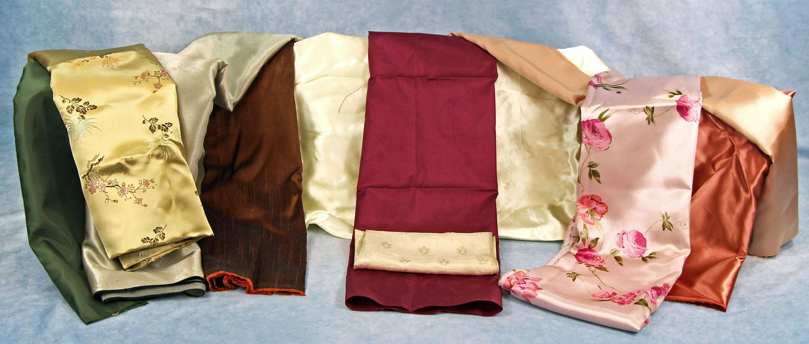225.  SILK AND SATIN FABRIC ASSORTMENT. Lot includes: (1 of 1)