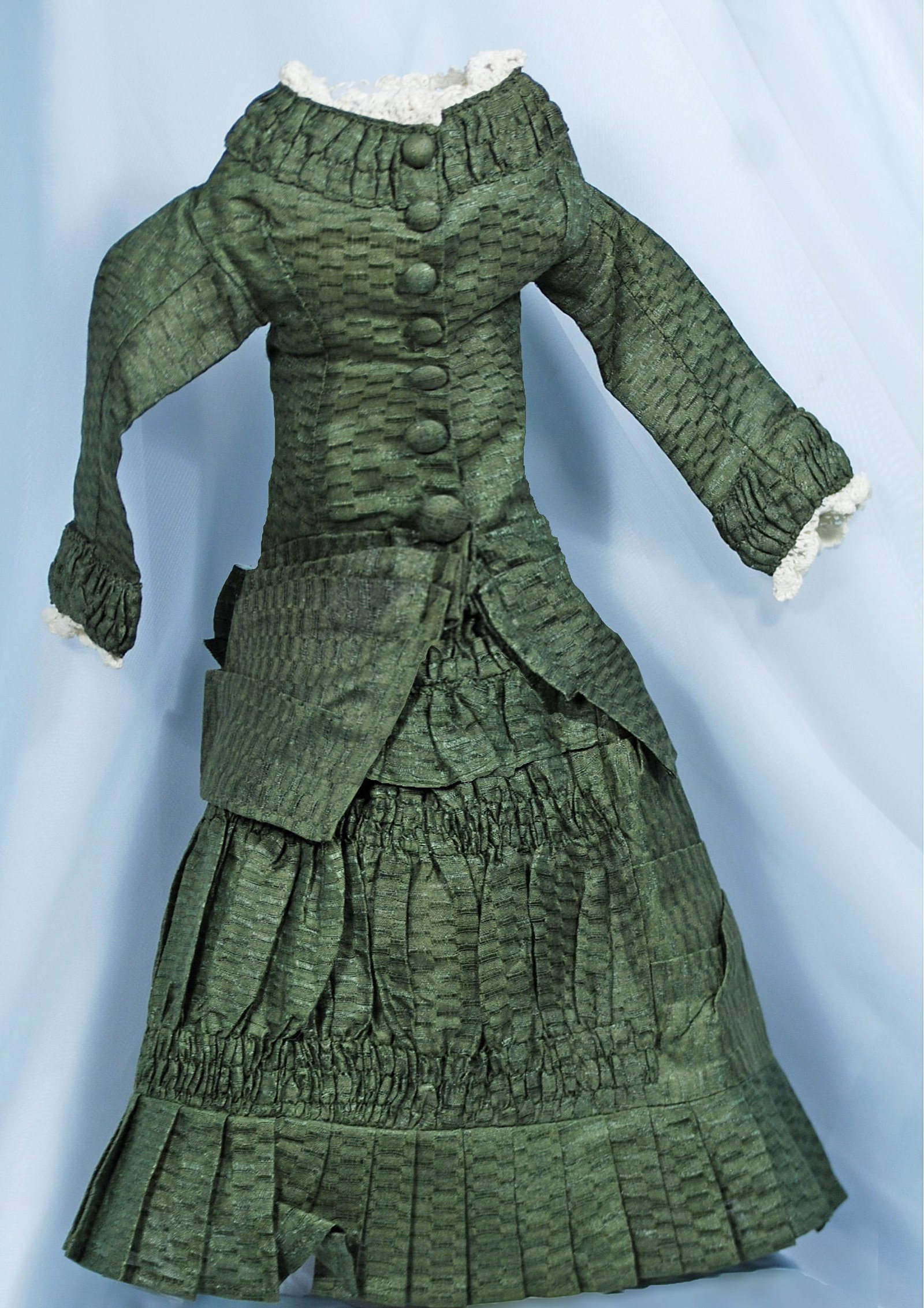 249. GREEN SILK FASHION GOWN. Two-piece green: 249. GREEN SILK FASHION GOWN. Two-piece green patterned silk fashion or lady gown features fitted jacket with button front closing, skirt with ruching, gathers and pleated detail, 4” shoulder wi