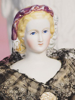 LOVELY BISQUE PARIAN LADY WITH PORTRAIT FACE. 14". : LOVELY BISQUE PARIAN LADY WITH PORTRAIT FACE. 14". Bisque shoulderhead with cameo-shaped face, slender throat, molded blonde hair drawn away from face and held by green molded snood decorated with whi
