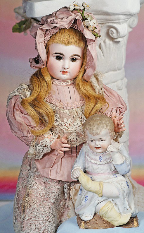 LOVELY FRENCH BISQUE BEBE BY RABERY & DELPHIEU. Mar: LOVELY FRENCH BISQUE BEBE BY RABERY & DELPHIEU. Marks: R 1 D. 20". Bisque socket head, brown paperweight eyes, painted lashes, feathered and brushstroked brows, pierced ears, closed mouth, blonde huma