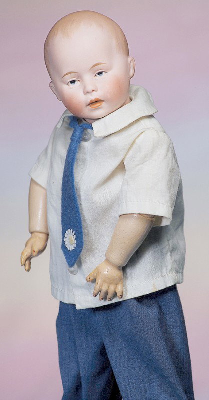 GERMAN BISQUE "DI" CHARACTER BOY BY SWAINE & CO. M: GERMAN BISQUE "DI" CHARACTER BOY BY SWAINE & CO. Marks: DI / 1. 12". Solid-dome bisque socket head, molded and brushstroked light brown hair, painted features, blue intaglio eyes, deeply-molded eyelid