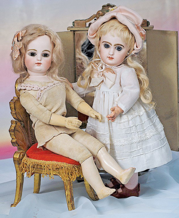 PETITE FRENCH BISQUE BLUE-EYED BEBE BY JUMEAU. Mar: PETITE FRENCH BISQUE BLUE-EYED BEBE BY JUMEAU. Marks: 4. 13". Bisque socket head, blue paperweight eyes, painted lashes, feathered and brushstroked brows, pierced ears, closed mouth, shaded and accent
