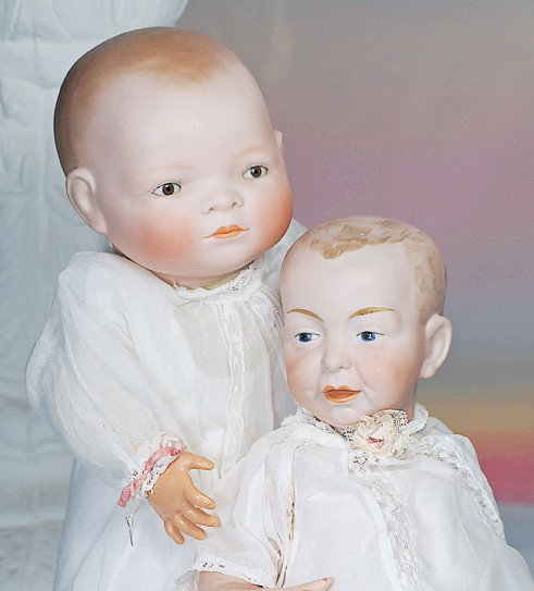 GERMAN BISQUE BROWN-EYED BYE-LO BABY. Marks: Cop: GERMAN BISQUE BROWN-EYED BYE-LO BABY. Marks: Copr. Grace S. Putnam. 17" L., 13 ¾" head circ. Solid-dome bisque swivel head with molded and painted brown hair, brown sleep eyes, painted lashes, tinted