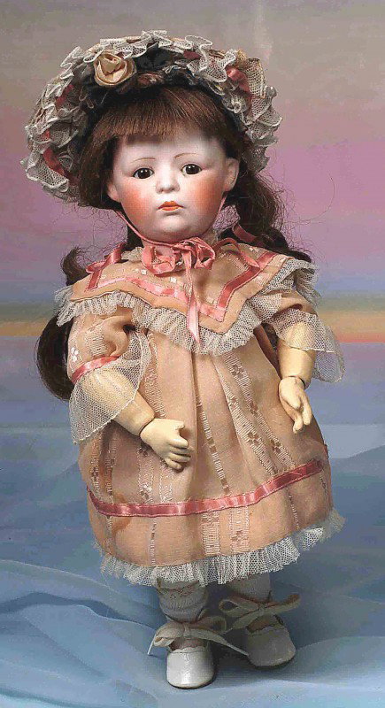 BISQUE PPOUTY HEUBACH-LOOK-ALIKE CHARACTER BY NIPP: BISQUE TODDLER WITH VERY POUTY FACE. Marks: F Y Nippon 301. 13”. Bisque socket head, brown sleep eyes, painted lashes, feathered brows, closed mouth with downturned corners, accented lips, human hai