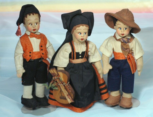 THREE LENCI-TYPE, ALL-ORIGINAL DOLLS.: 8 1/2". Felt dolls with painted features, provincial felt costumes, surprised eyes, cotton socks, felt shoes.
