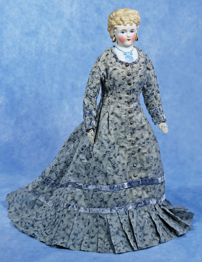 GERMAN BISQUE LADY WITH BLONDE CURLS AND SCULPTED BODICE BY KLING: 14. GERMAN BISQUE LADY WITH BLONDE CURLS AND SCULPTED BODICE BY KLING. 16”. Bisque shoulderhead with blonde sculpted hair arranged in layered curls waved behind modeled and pierced ears, sculpte