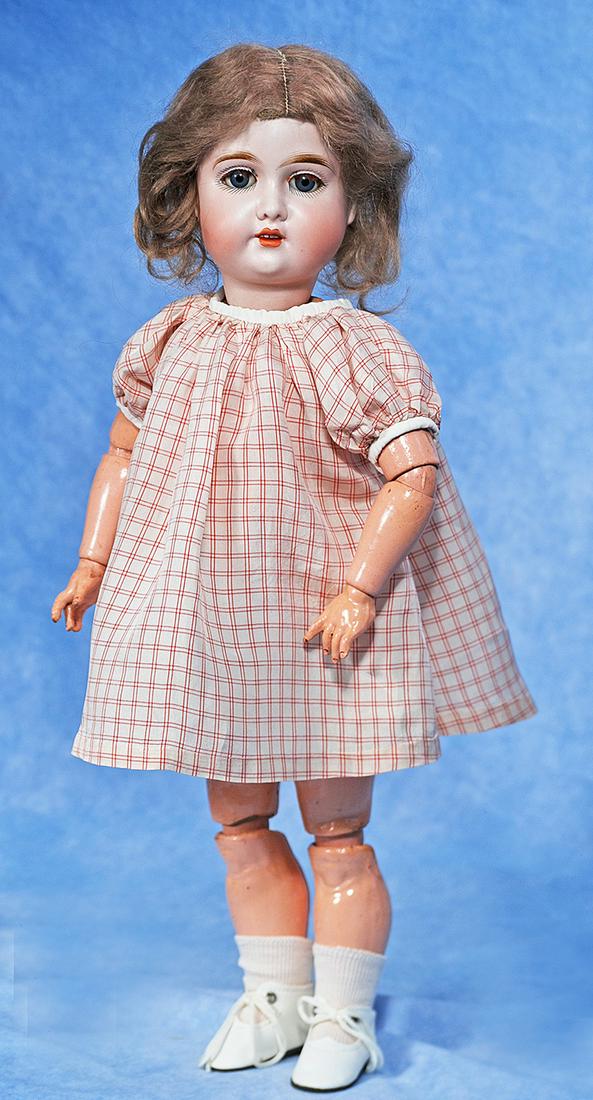 GERMAN BISQUE CHILD BY GEBRUDER KUHNLENZ: 45. GERMAN BISQUE CHILD BY GEBRUDER KUHNLENZ. 19”. Marks: 285 Gbr 165 K 4 Germany. Bisque socket head, blue sleep eyes, painted and applied lashes, feathered brows, open mouth, accented lips, up