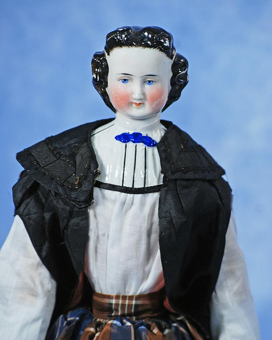 GERMAN PORCELAIN LADY WITH RARE COIFFURE AND BODICE BY C.F KLING: 89. GERMAN PORCELAIN LADY WITH RARE COIFFURE AND BODICE BY C.F. KLING. 14 ½”. Porcelain shoulderhead with sculpted black hair with stippled detail, hair waved away from face and secured b