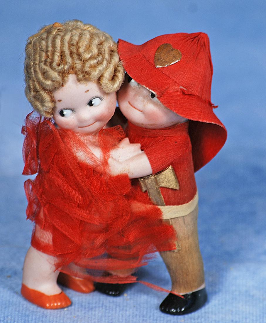 VERY RARE KEWPIE HUGGERS AS FIREMAN RESCUING LADY (1 of 1)