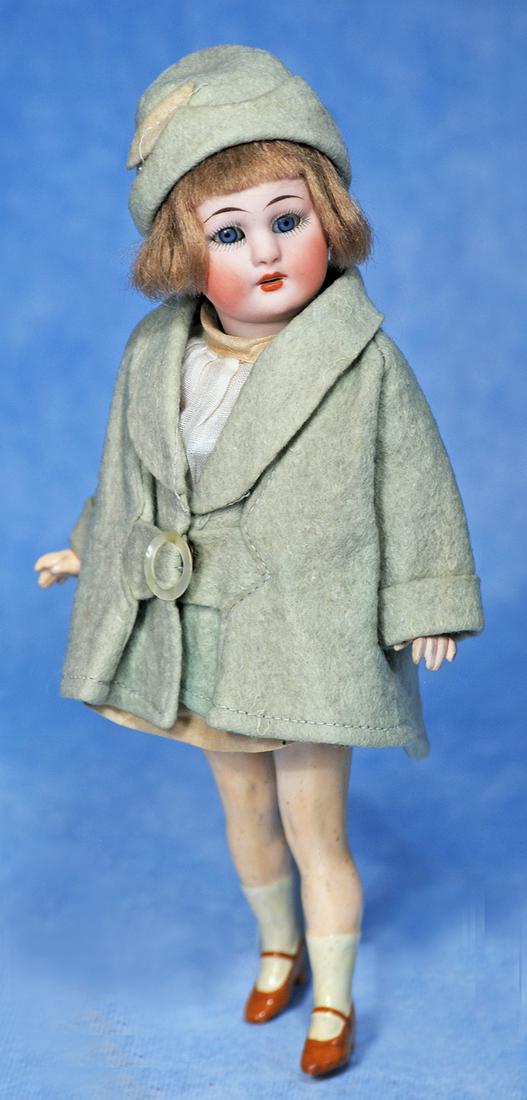 PETITE GERMAN BISQUE FLAPPER BY SIMON & HALBIG: 139. PETITE GERMAN BISQUE FLAPPER BY SIMON & HALBIG. 8 ½”. Marks: 1078 Halbig S & H Germany. Bisque socket head, blue sleep eyes, painted lashes, tapered brows, open mouth, upper teeth, o