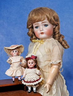 TWO MINIATURE GERMAN ALL-BISQUE DOLLS: 177. TWO MINIATURE GERMAN ALL-BISQUE DOLLS. Each is all-bisque, jointed at shoulders and hips, sleep eyes, painted lashes and brows, closed mouth. 5 ½” doll by Kestner marked 150, brunett