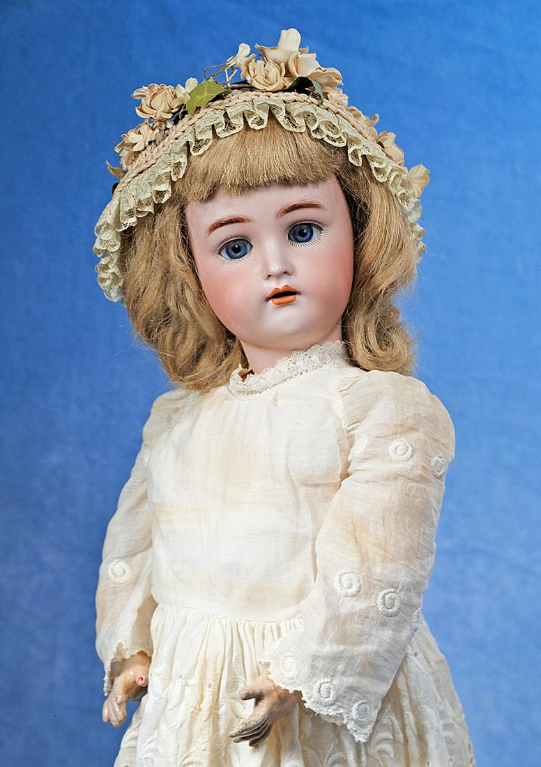 GERMAN BISQUE CHILD BY KAMMER AND REINHARDT: 194. GERMAN BISQUE CHILD BY KAMMER AND REINHARDT. 24”. Marks: Simon & Halbig, K * R 62. Bisque socket head, blue sleep eyes, painted and applied lashes, feathered brows, pierced ears, open mouth