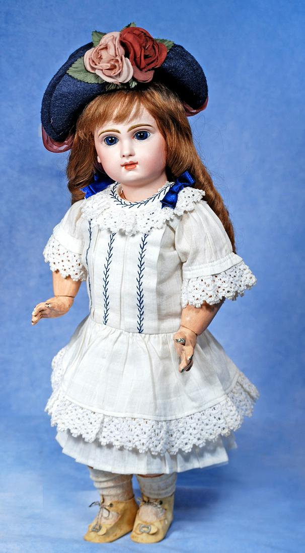 LOVELY FRENCH BISQUE BEBE BY JUMEAU: 197. LOVELY FRENCH BISQUE BEBE BY JUMEAU. 19”. Marks Depose Tete Jumeau Bte SGDG 8 (head); Jumeau Medaille d’­Or Paris (body). Bisque socket head, deep blue paperweight eyes, painted