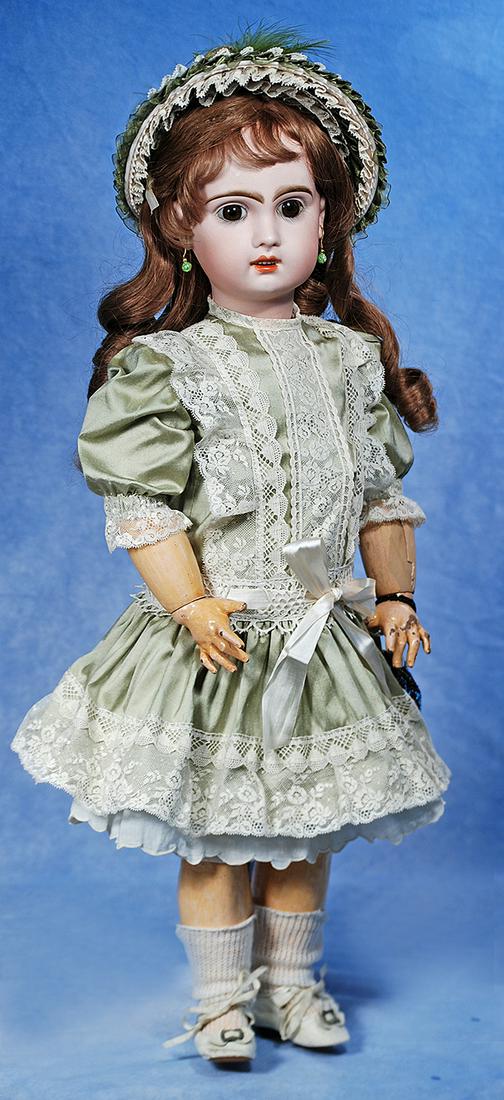 FRENCH BISQUE BEBE BY JUMEAU: 199. FRENCH BISQUE BEBE BY JUMEAU. Marks: 10. 14”. Bisque socket head, brown paperweight eyes, painted lashes, eyeliner, feathered and brushstroked brows, pierced ears, open mouth, shaded and ac