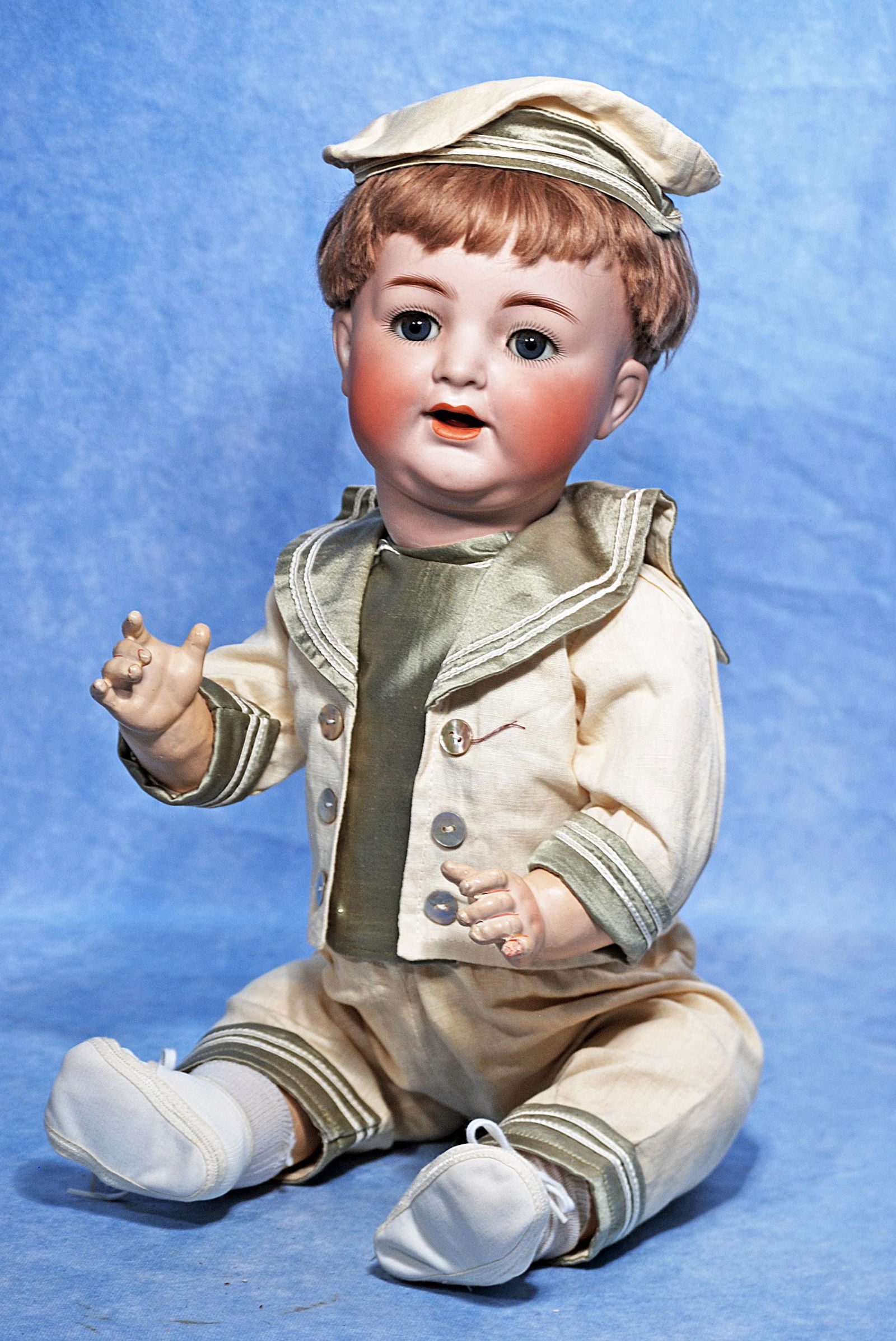 GERMAN BISQUE CHARACTER BABY BY KAMMER AND REINHARDT: 201. GERMAN BISQUE CHARACTER BABY BY KAMMER AND REINHARDT. 20”. Marks: K * R, Simon & Halbig 126. Bisque socket head, blue sleep eyes, painted and applied lashes, feathered brows, open mouth, ac