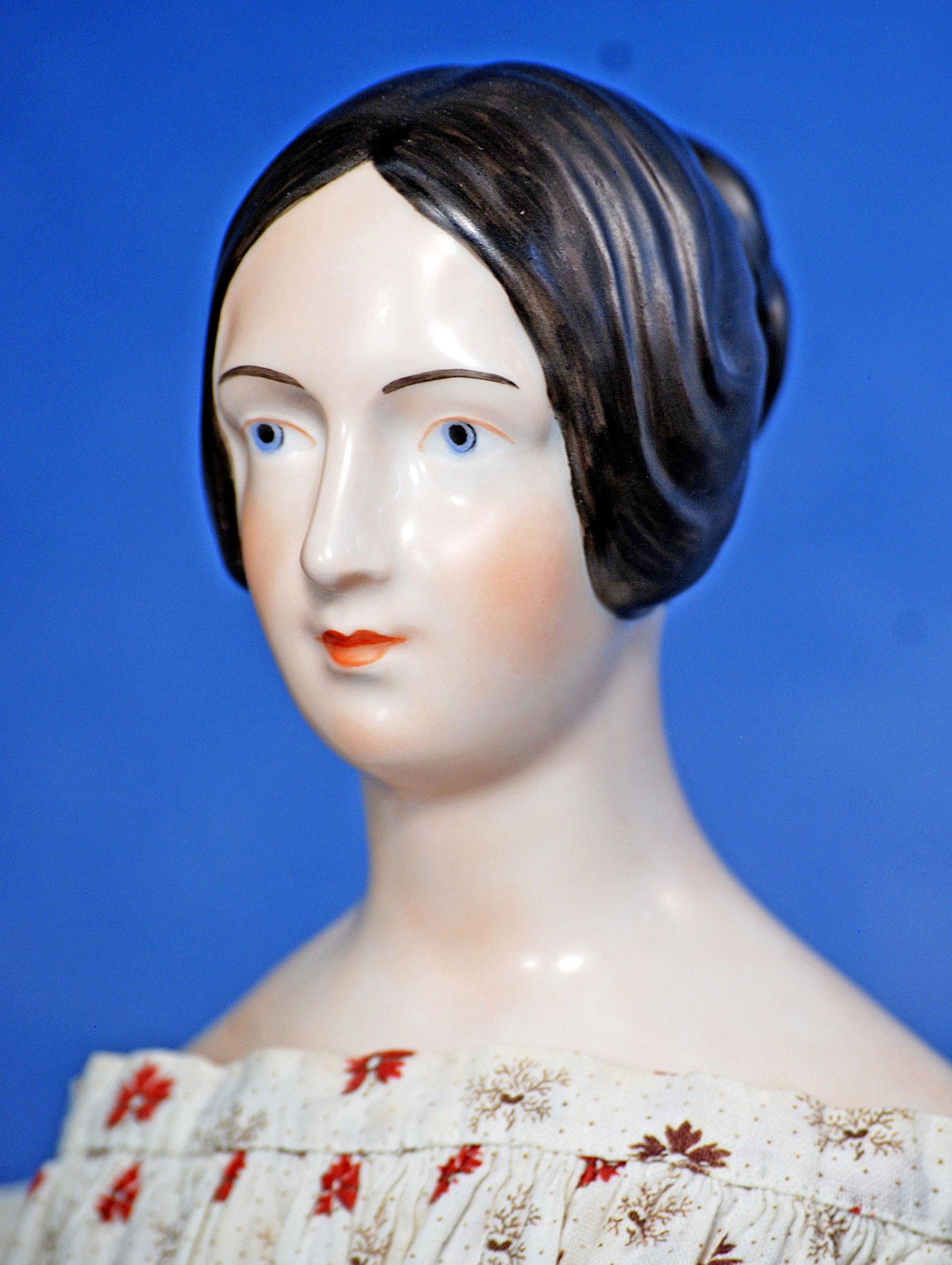 REPRODUCTION OF KPM PORCELAIN LADY: 272. REPRODUCTION OF KPM PORCELAIN LADY. 19”. Porcelain shoulder head with brown sculpted hair waved loosely over the ears and drawn into a coiled chignon at the back of the head, painted facial