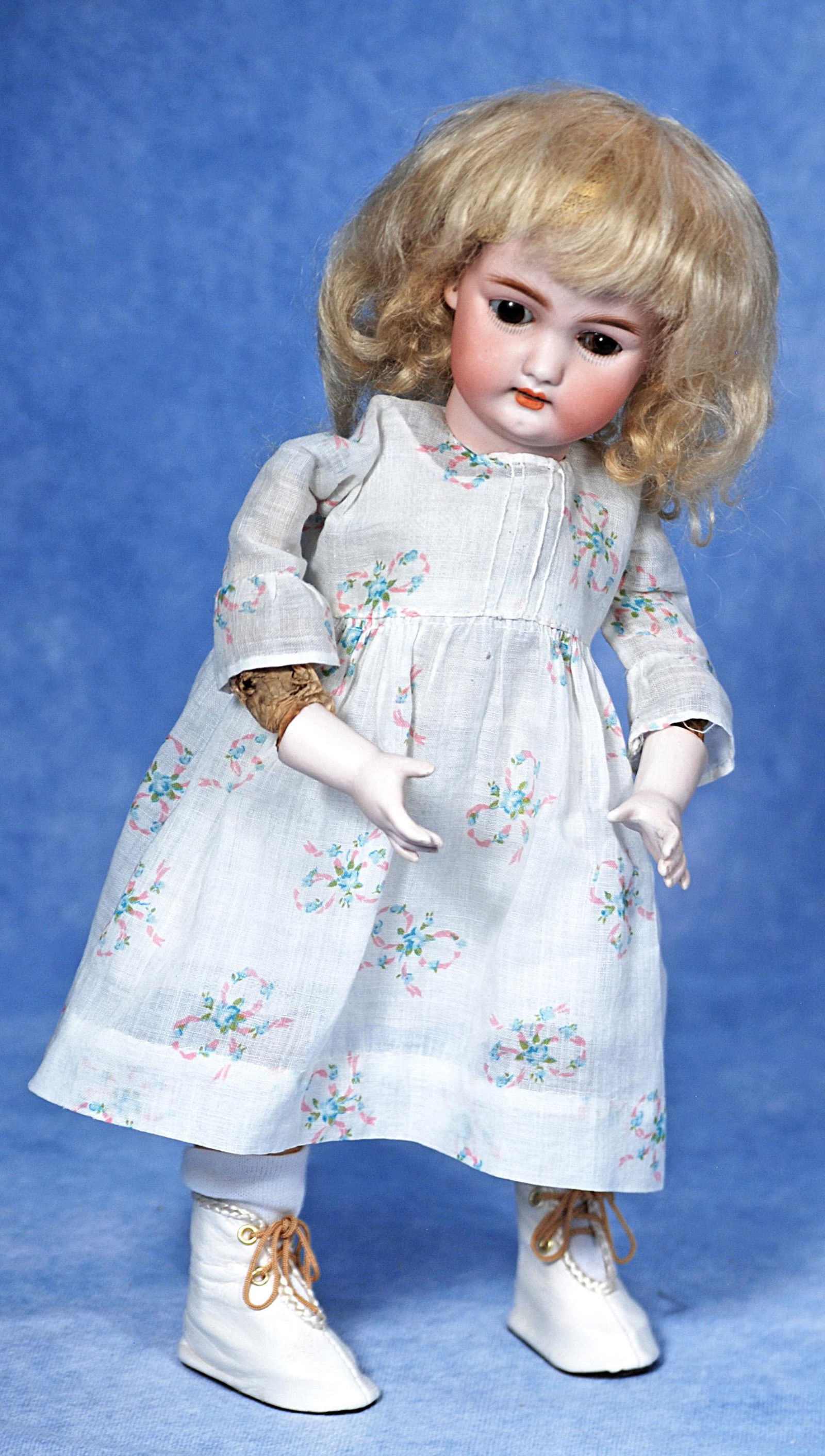 SIMON & HALBIG, MODEL 1300, MECHANICAL WALKING DOLL: 284. SIMON & HALBIG, MODEL 1300, MECHANICAL WALKING DOLL. 12 ½”. Marks: 1300 – 4 ½ Dep S & H. Bisque head doll with stationary brown glass eyes, painted lashes, feathered brows,