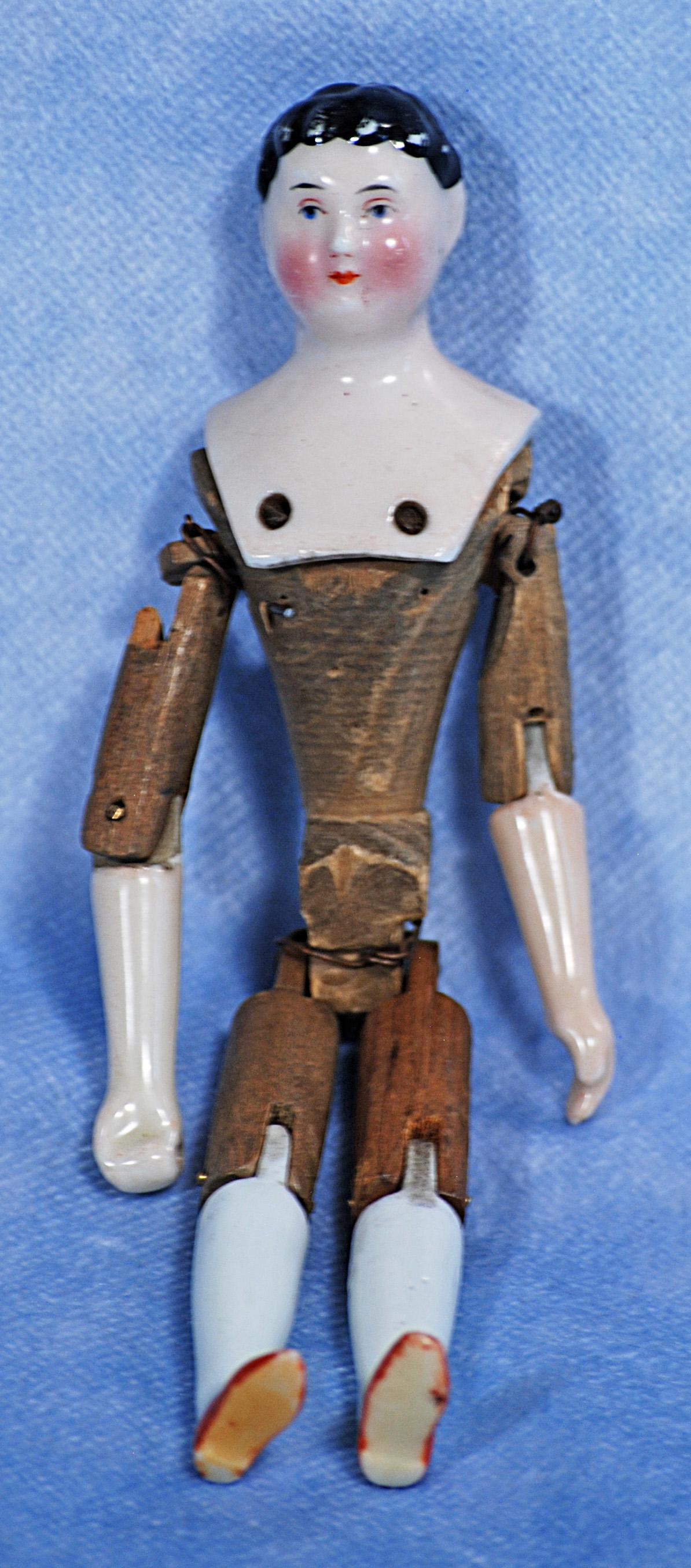 MINIATURE PORCELAIN DOLL WITH WOODEN-ARTICULATED BODY (1 of 1)