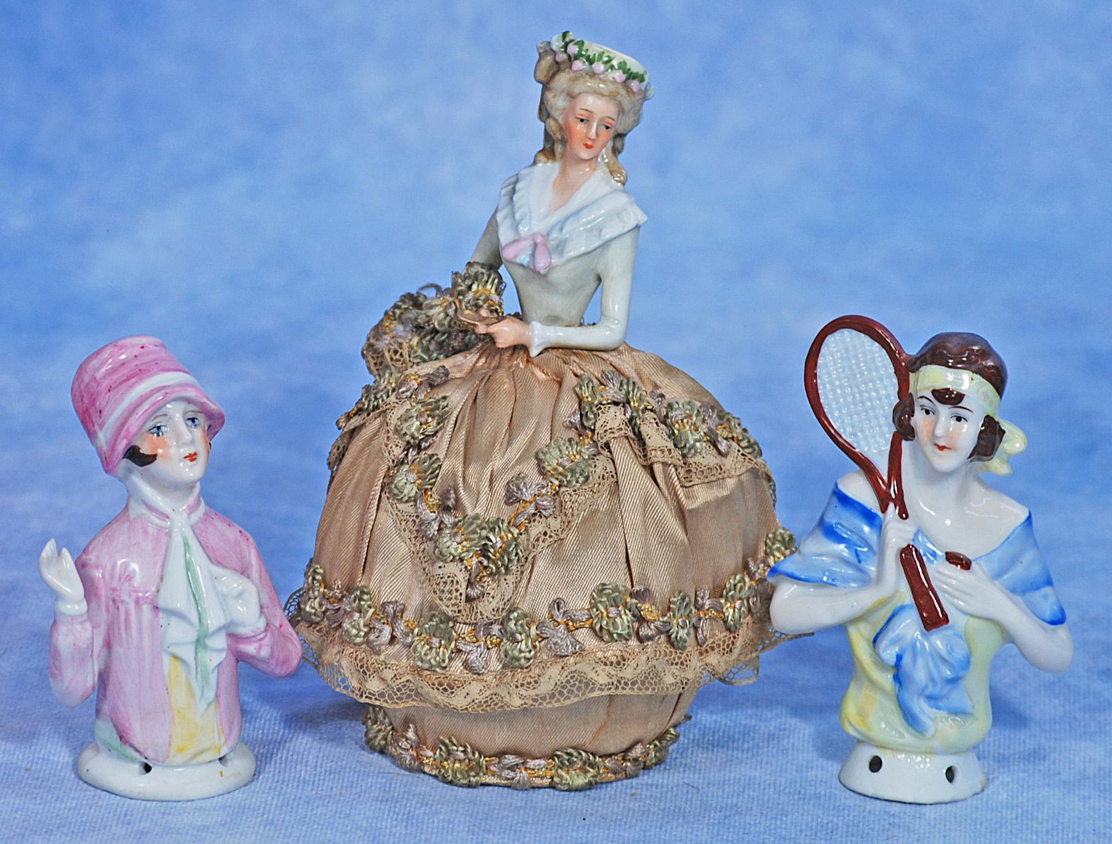 THREE GERMAN PORCELAIN HALF DOLLS. (1 of 1)