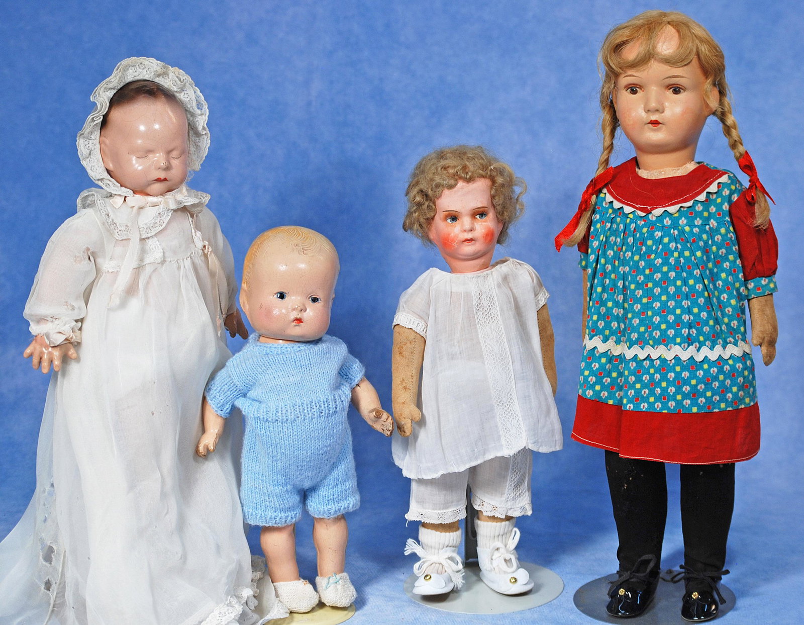 FOUR COMPOSITION DOLLS. (1 of 1)