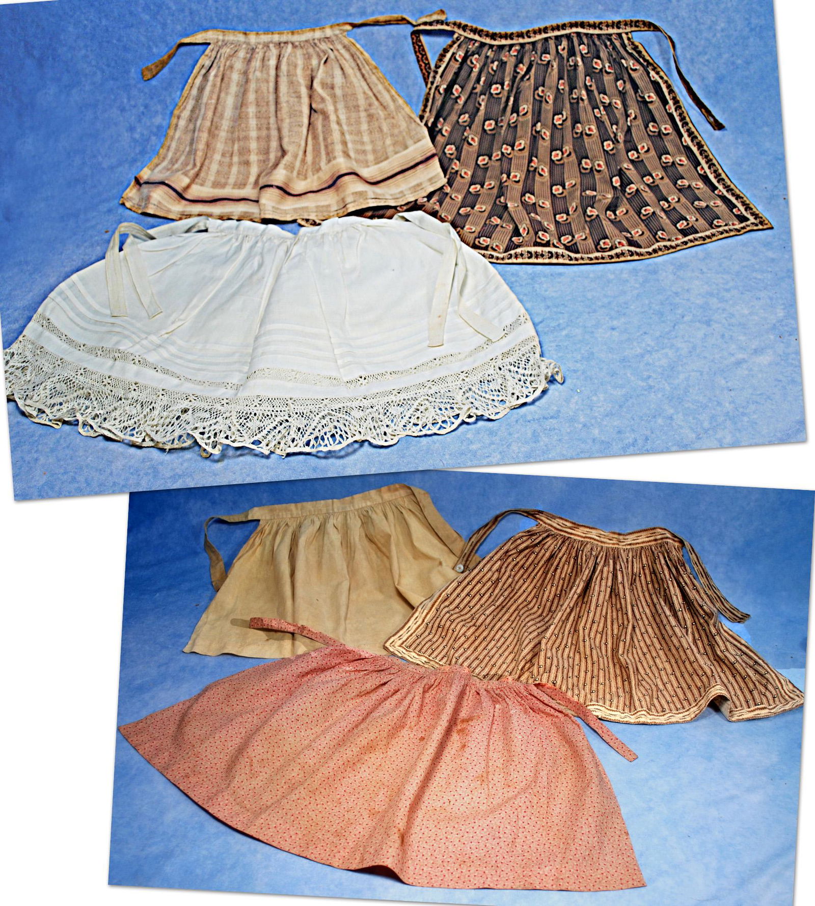 COLLECTION OF ANTIQUE COTTON DOLL APRONS. (1 of 3)