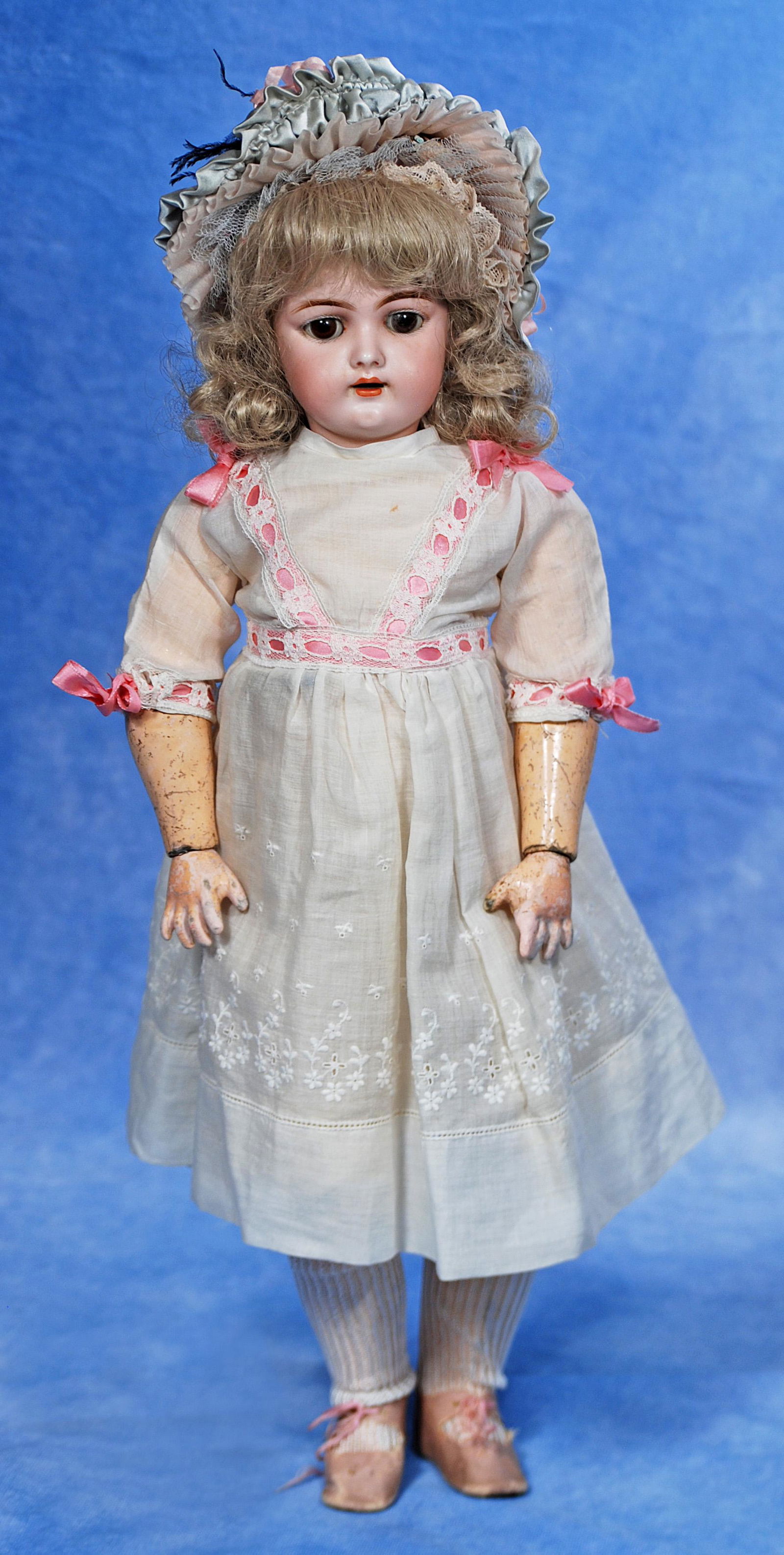 GERMAN BISQUE CHILD, 109, BY HANDWERCK.: GERMAN BISQUE CHILD, 109, BY HANDWERCK. 18". Marks: 109. Bisque socket head, brown sleep eyes, painted lashes, feathered brows, open mouth, accented lips, upper teeth, brown human hair wig, compositio