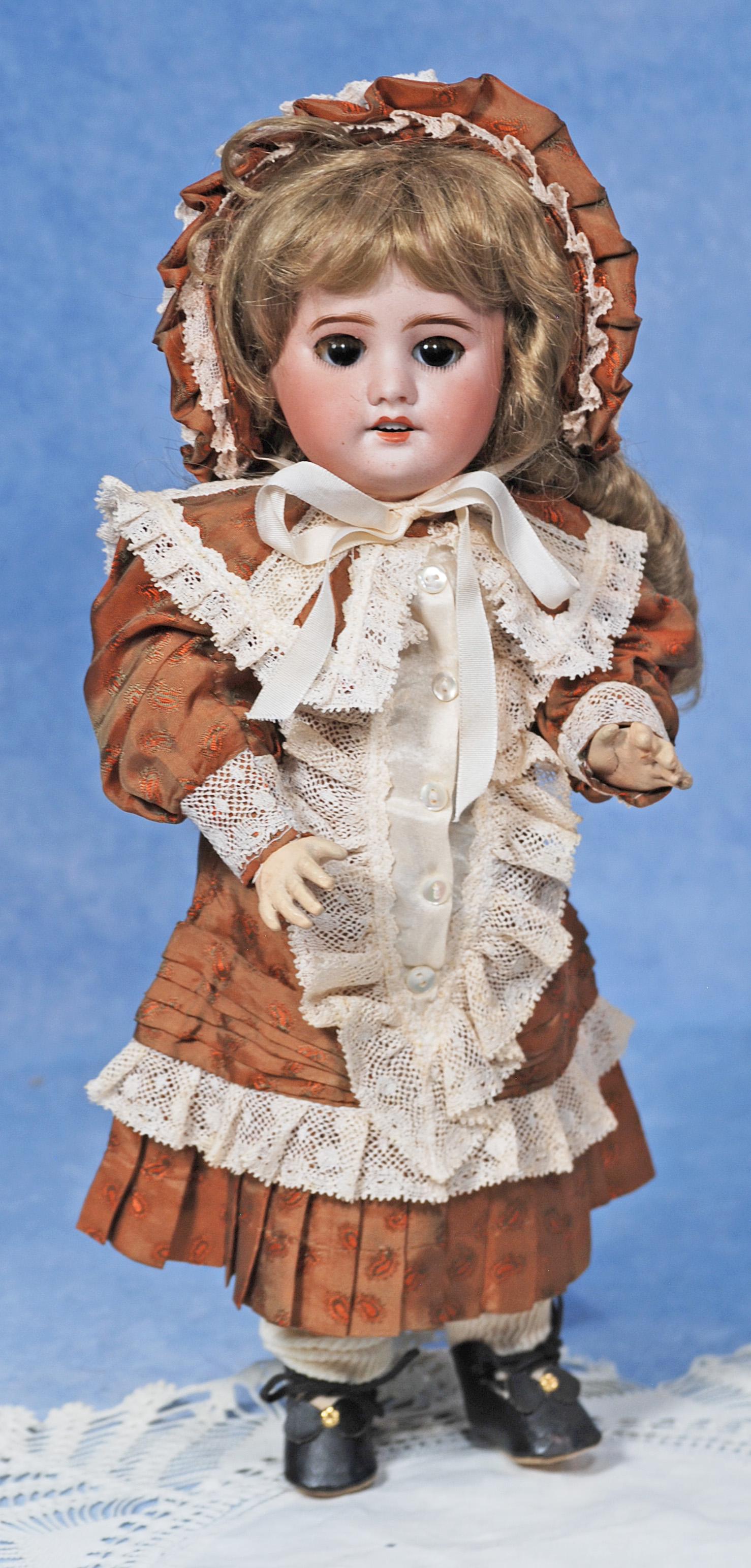 FRENCH BISQUE BEBE BY SFBJ.: FRENCH BISQUE BEBE BY SFBJ. 14”. Marks: SFBJ 60 Paris. Bisque socket head, brown sleep eyes, painted and applied lashes, feathered brows, open mouth, upper teeth, synthetic wig, French wooden an